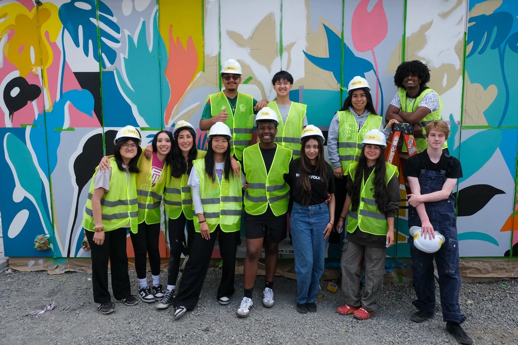 Students volunteering on a community mural project